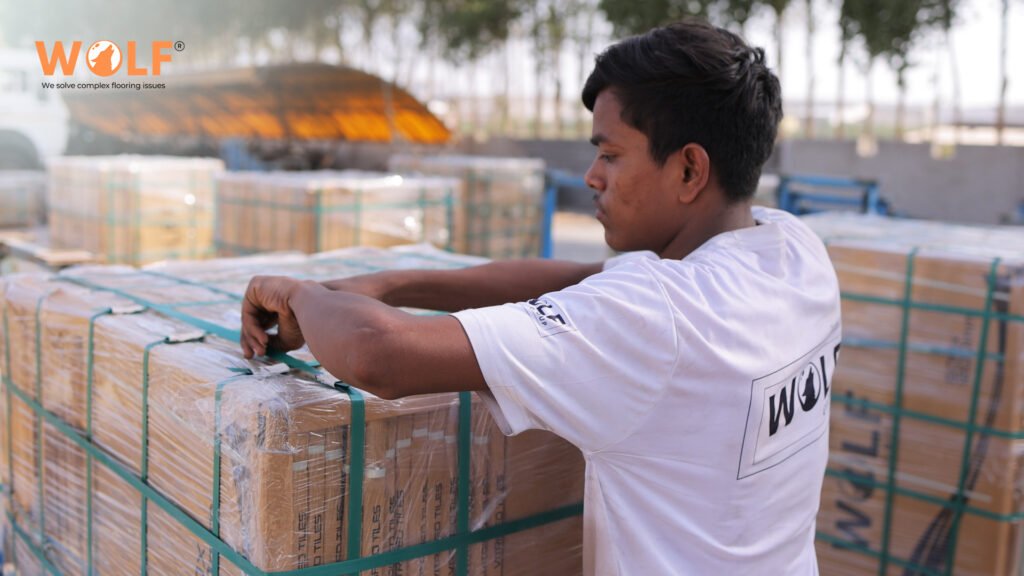 Wolf Group India worker inspecting porcelain tile shipment for export to Canada