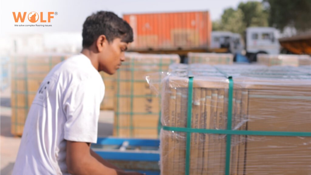 Porcelain tile cartons secured on pallets for container loading.