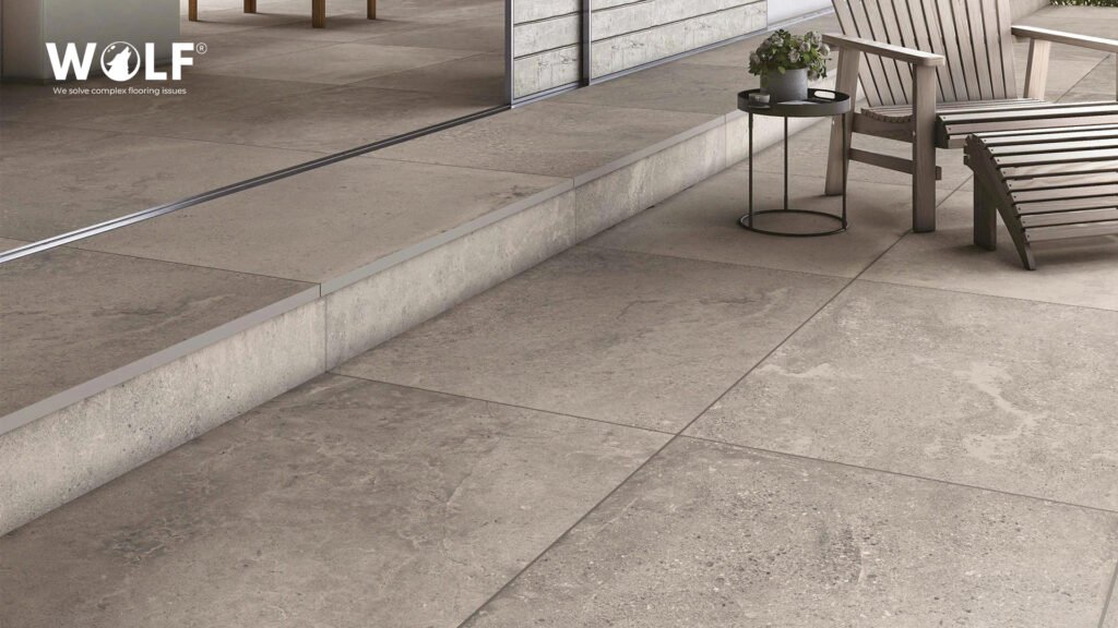 Stone-look outdoor porcelain pavers on a terrace and entrance area