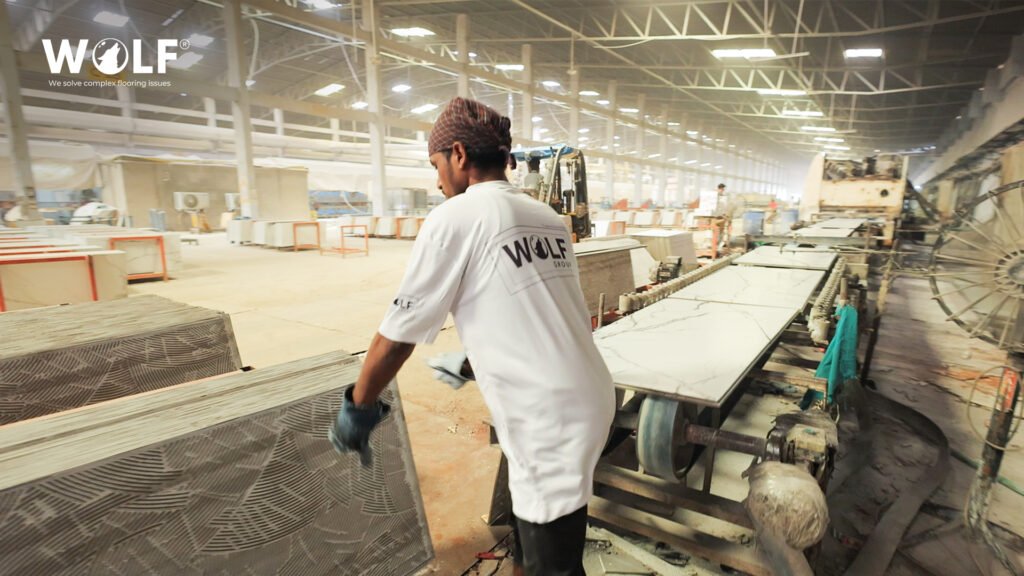 Wolf Group porcelain tile factory worker on a production line in Morbi, India